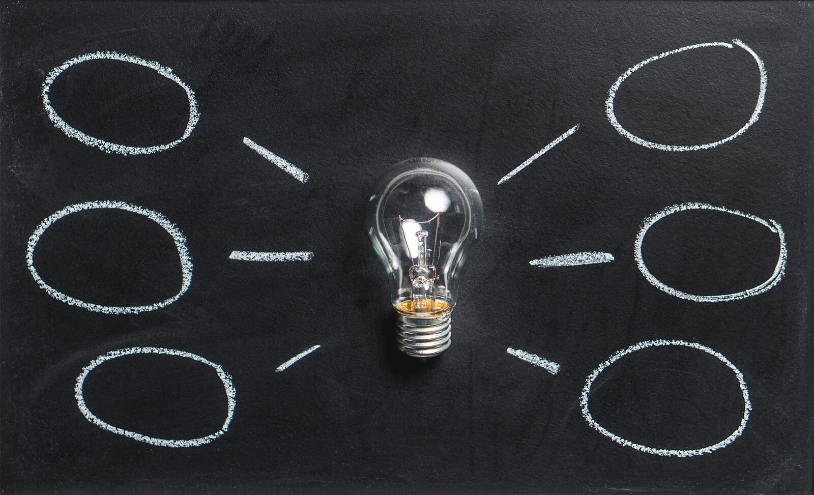 Light bulb with speech bubbles all around it