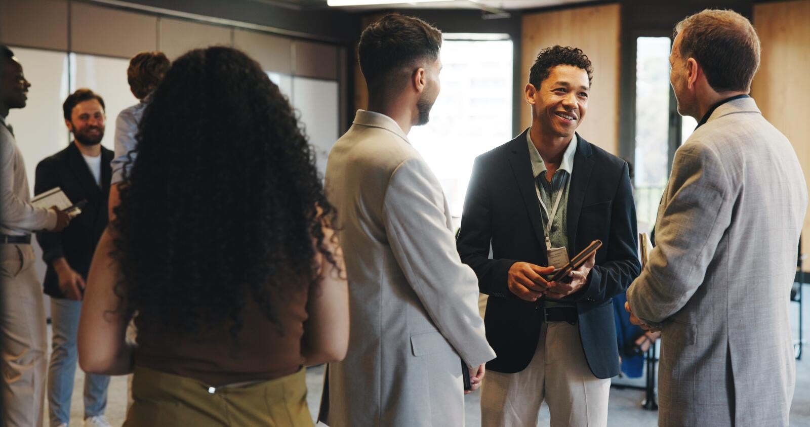 Group of professionals talking at a networking event
