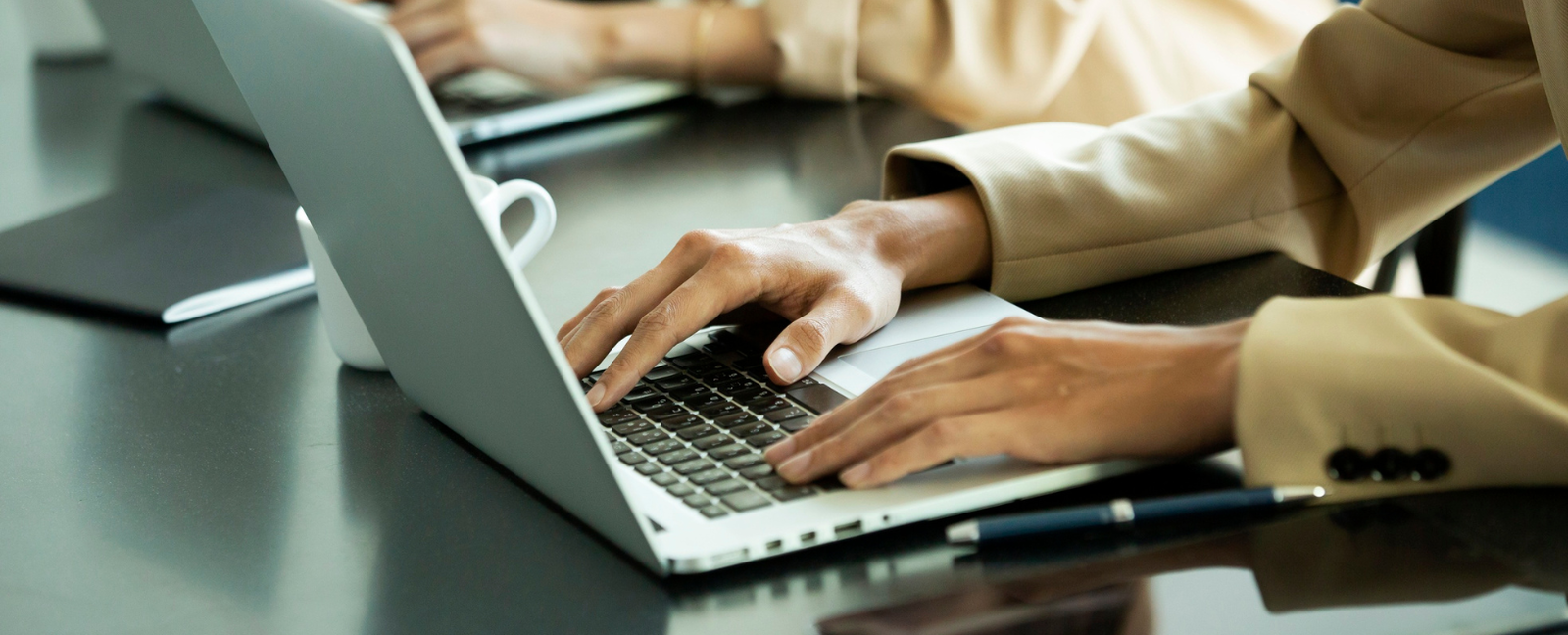 woman typing on laptop
