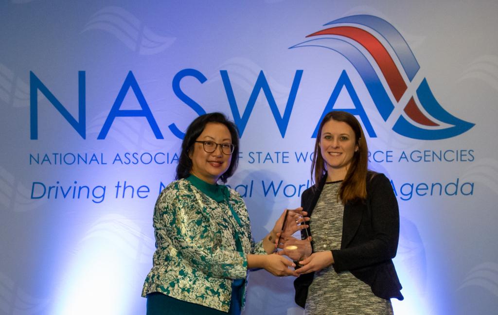 Accepting the Data Insights and Innovations Award, Adrienne Johnston, Bureau Chief, Workforce Statistics and Economic Research poses with Anna Hui, NASWA Board President