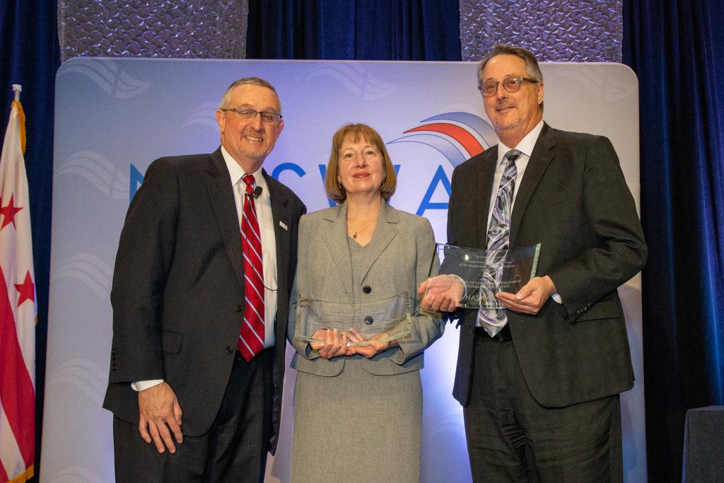Carol Dobak, Acting Deputy Commissioner, Rehabilitation Services Administration, Office of Special Education and Rehabilitative Services, U.S. Department of Education, and Stephen Wooderson, Executive Director, Council of State Administrators of Vocational Rehabilitation pose with Scott Sanders, NASWA Executive Director accepts award from Scott Sanders, NASWA Executive Director